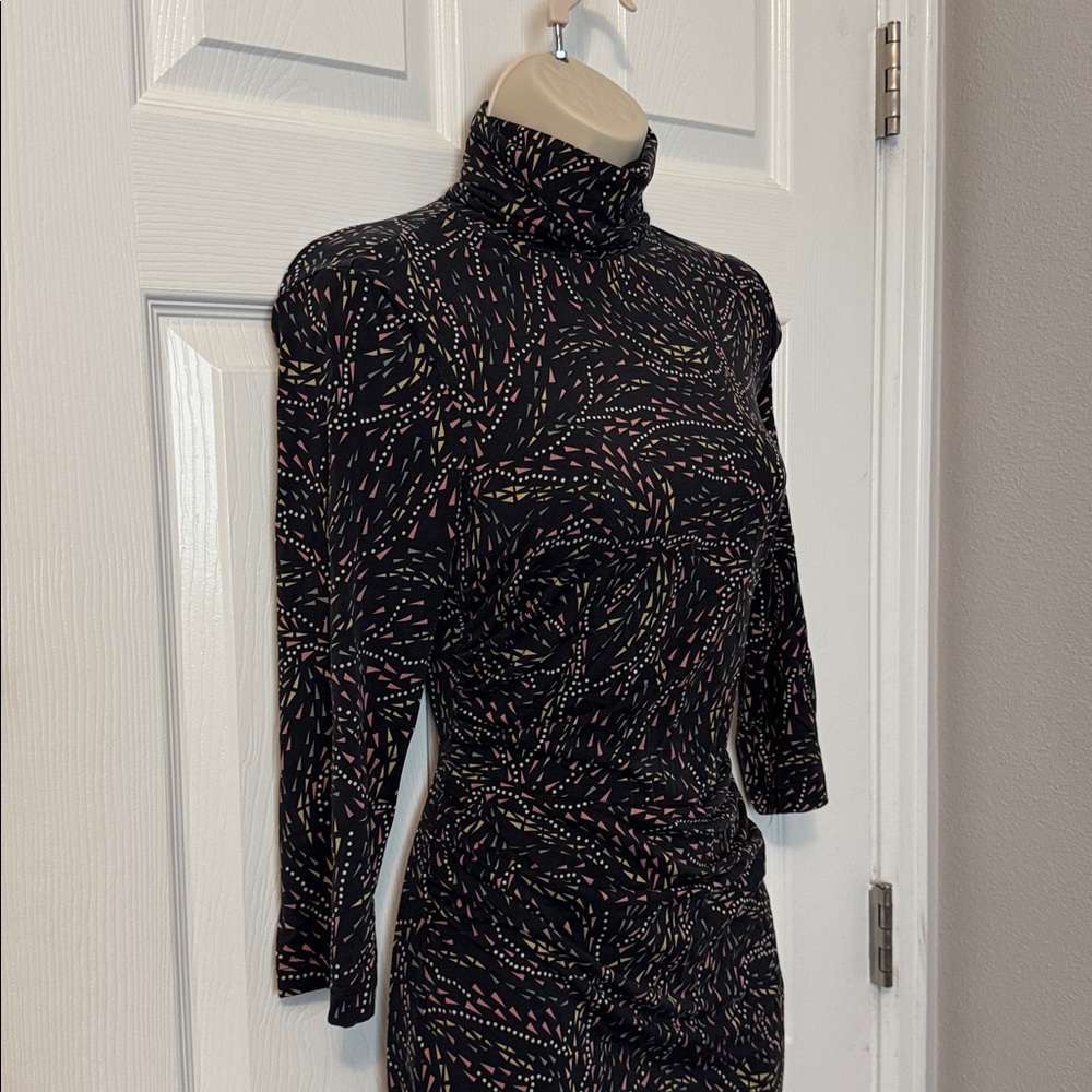 Diane VonFurstenberg silk geometric print turtleneck dress.
